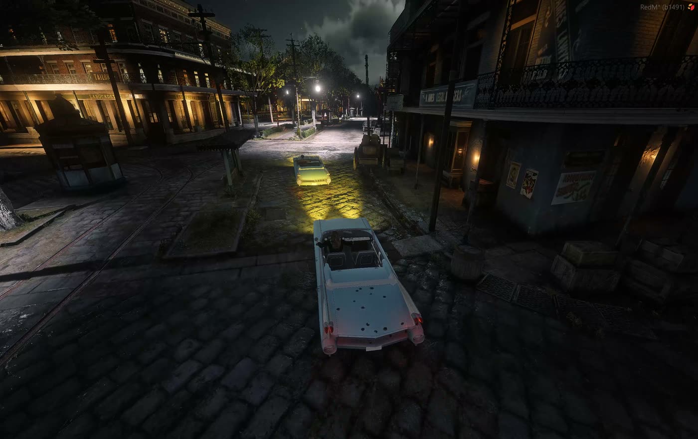 A car on cobblestones with its tail lights lit