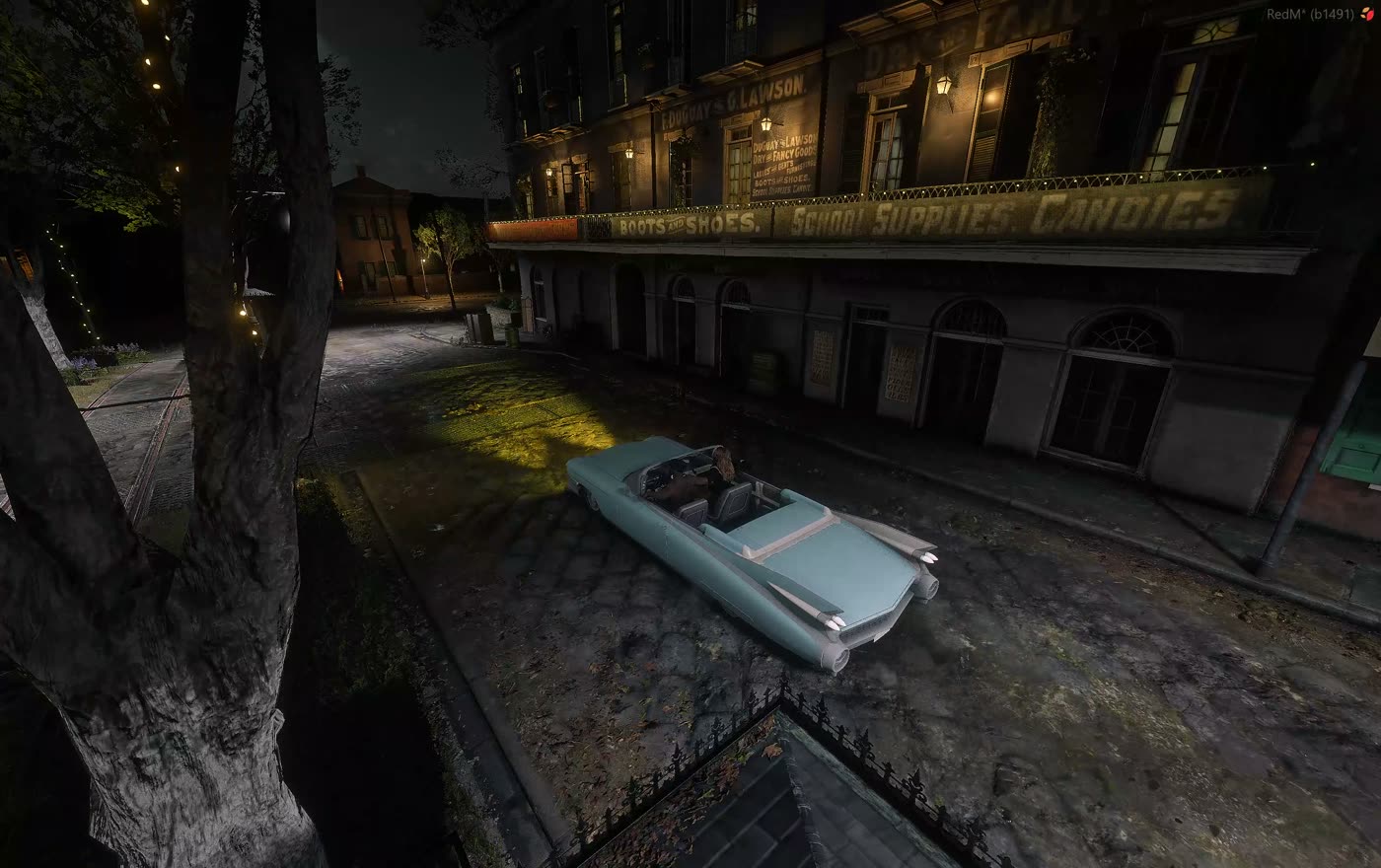 A car parked in front of a lit building