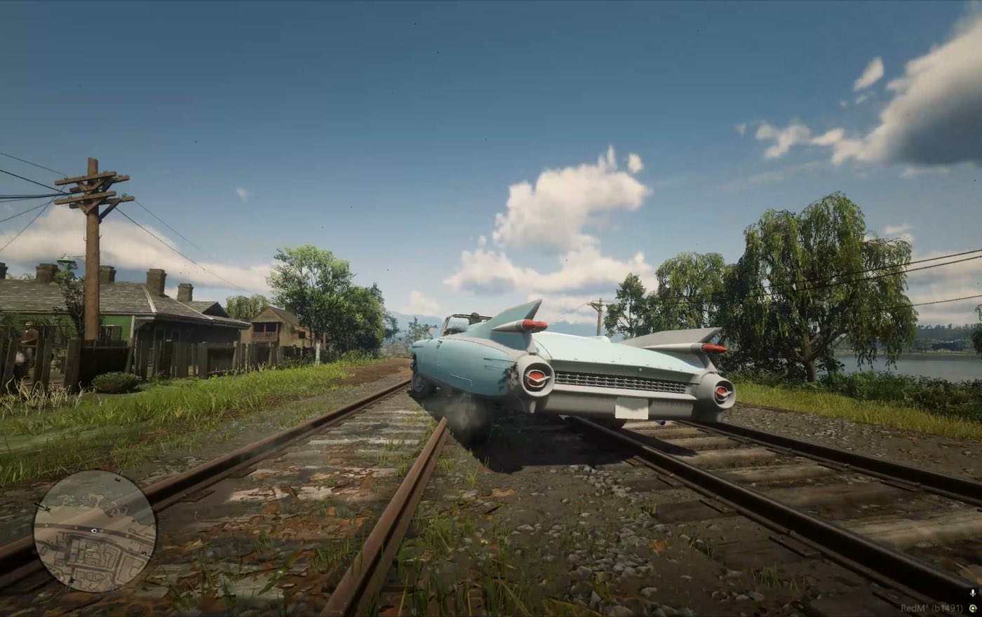 A car leaning as it rides over the rails by the lake