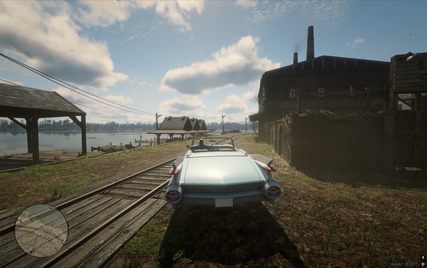 A car standing on the sleepers at the lake shore