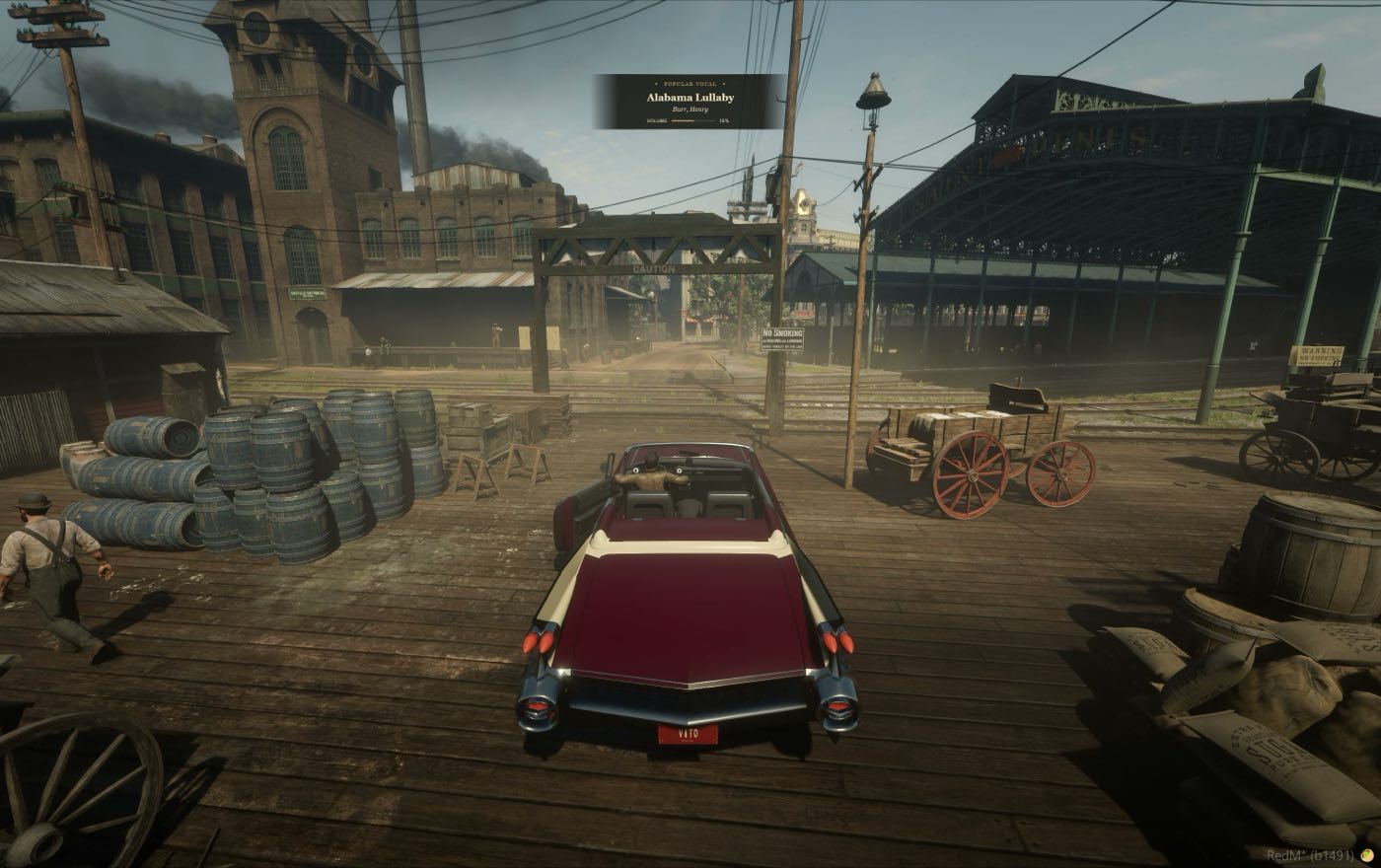 A car on the dock boards with the warehouses behind it