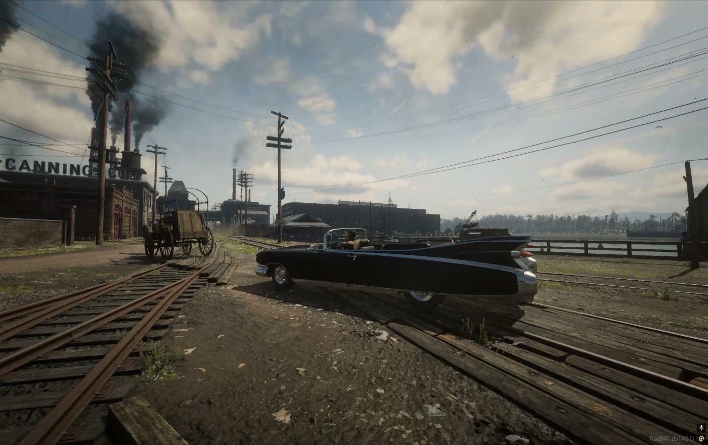 A car standing in the rail yard beside the cannery